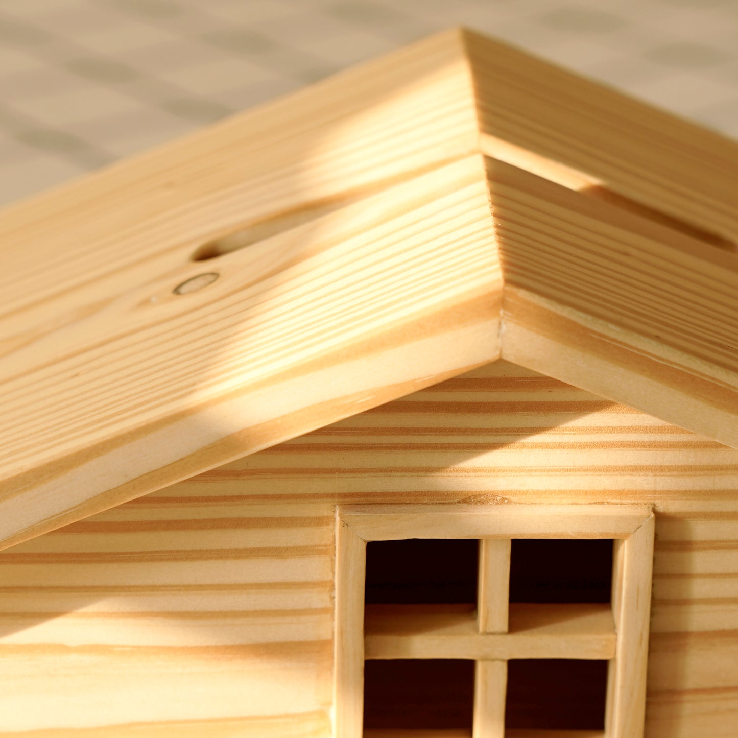 A Good Life wooden cabin style tissue holder featuring detailed roof and window design