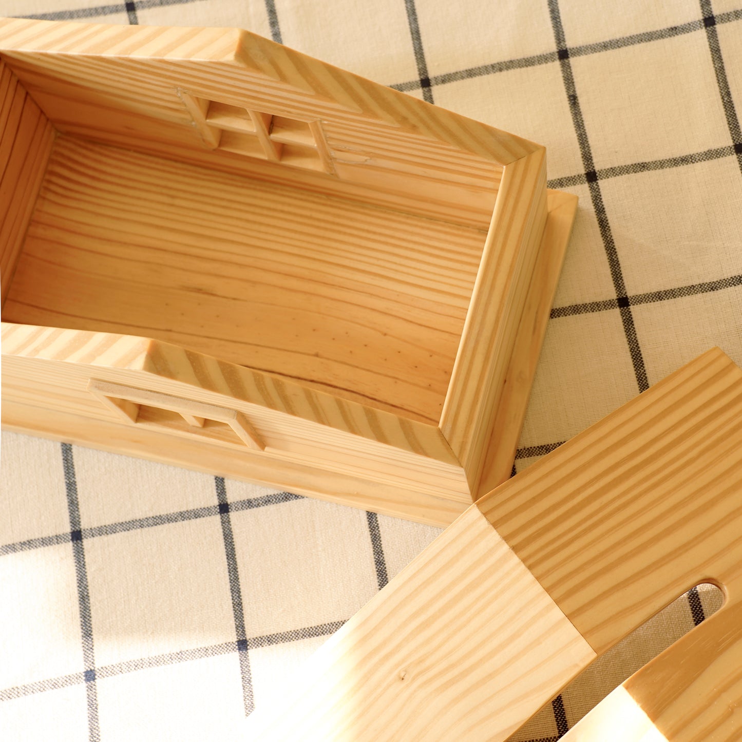 A Good Life wooden cabin style tissue holder with removable lid on checkered tablecloth