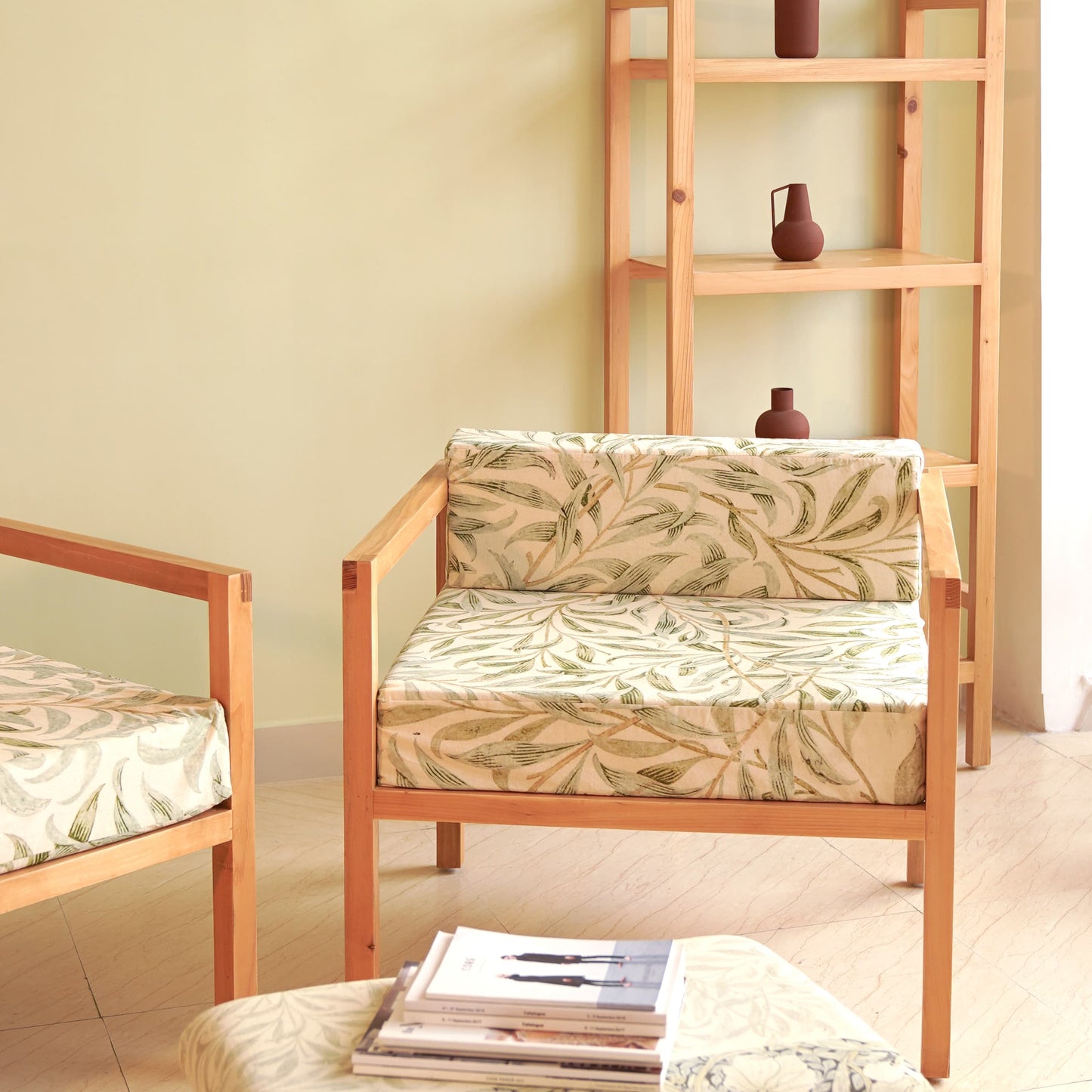 A Good Life minimalist pinewood lounge chair with patterned cushions in a cozy living space