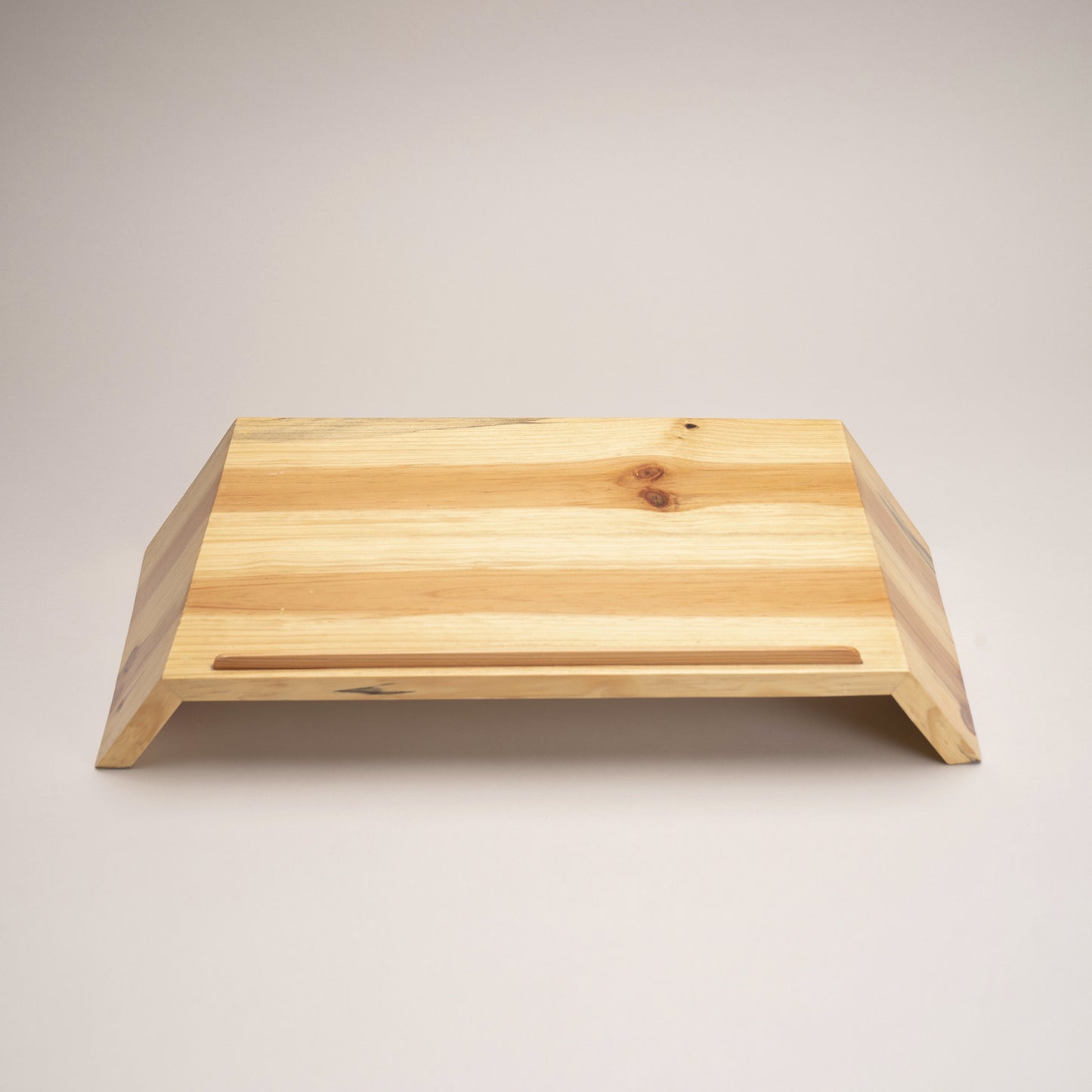 A Good Life minimalist laptop riser for desk made of natural wood with angled design