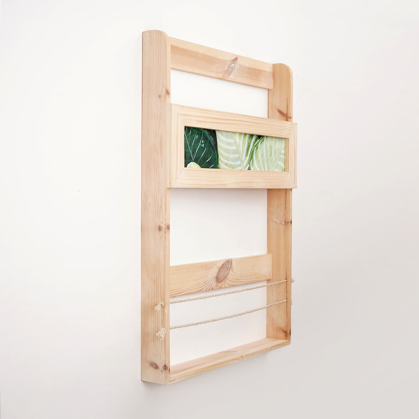 A Good Life minimalist magazine rack wooden quote bookshelf mounted on white wall