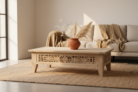 Reclaimed heritage pinewood coffee table with traditional Indian carved motifs in a minimalist modern Indian home interior