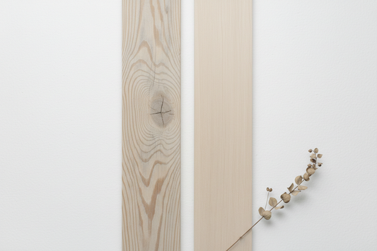 Side by side comparison of reclaimed pinewood and new wood furniture in a minimalist Nordic Indian home interior