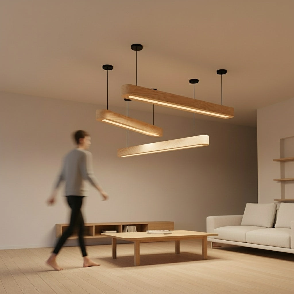 Modern natural pinewood light fixture with a sleek rectangular design hanging from black ceiling mounts
