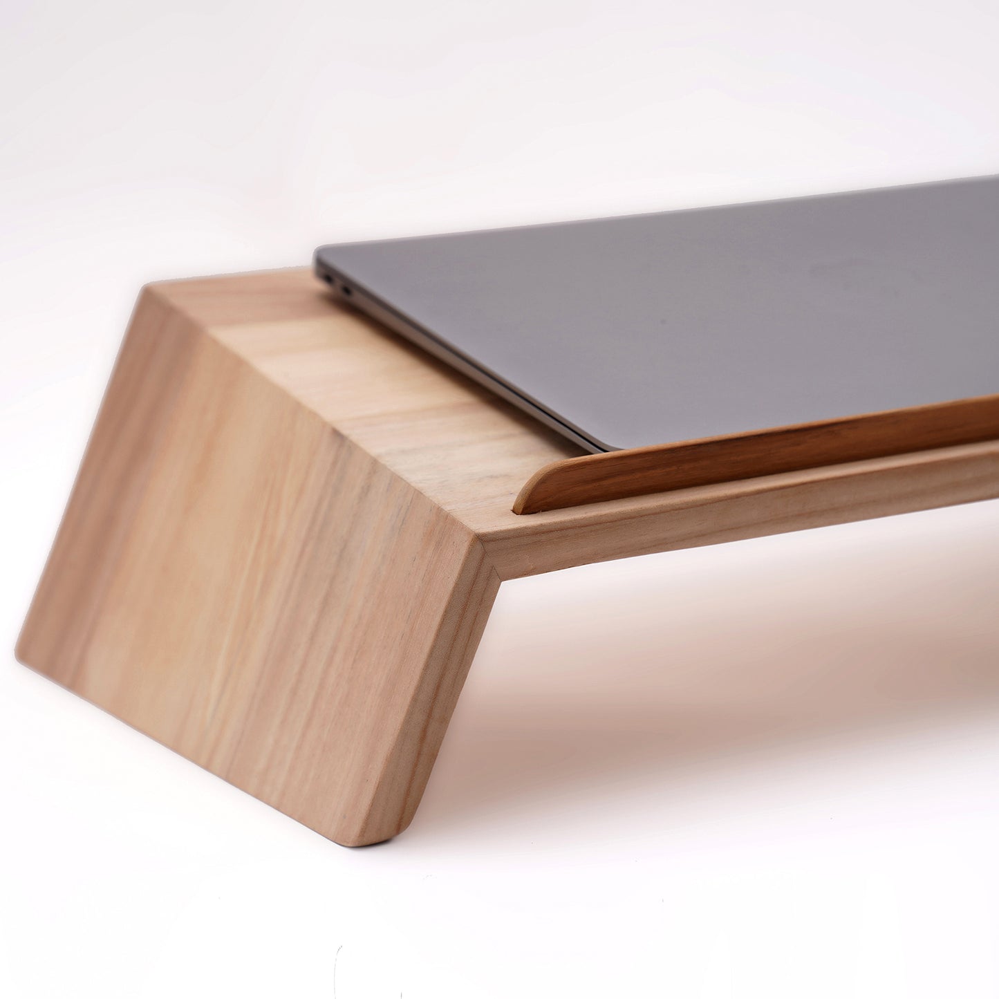 Elevate your workspace aesthetic with a wooden MacBook stand, embodying premium quality and classy appeal.