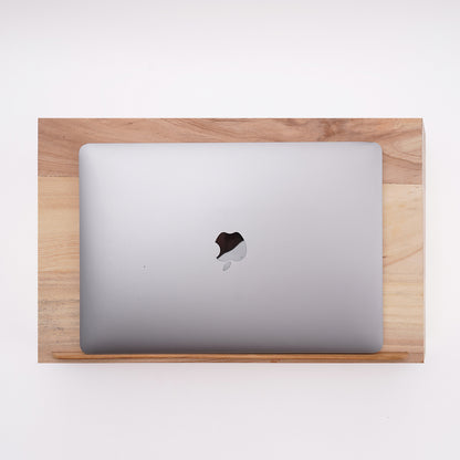 Upgrade your MacBook setup with a premium wooden stand, adding a touch of classy elegance to your workspace