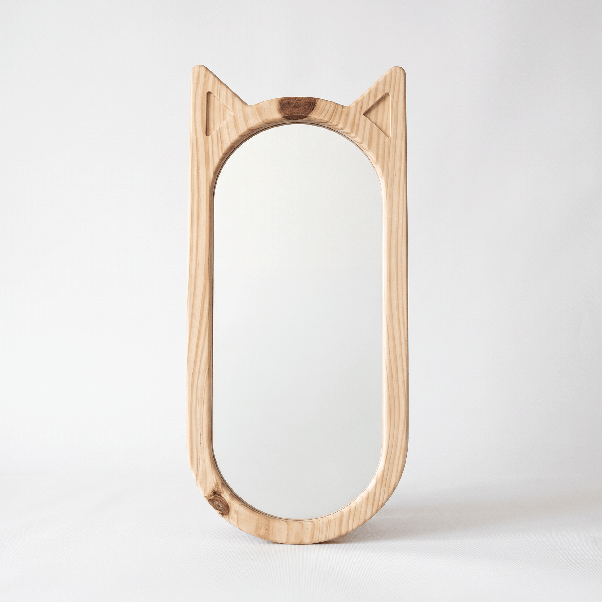 Hana wooden cat-ear mirror in natural pinewood styled in a minimalist Japandi living room — A Good Life