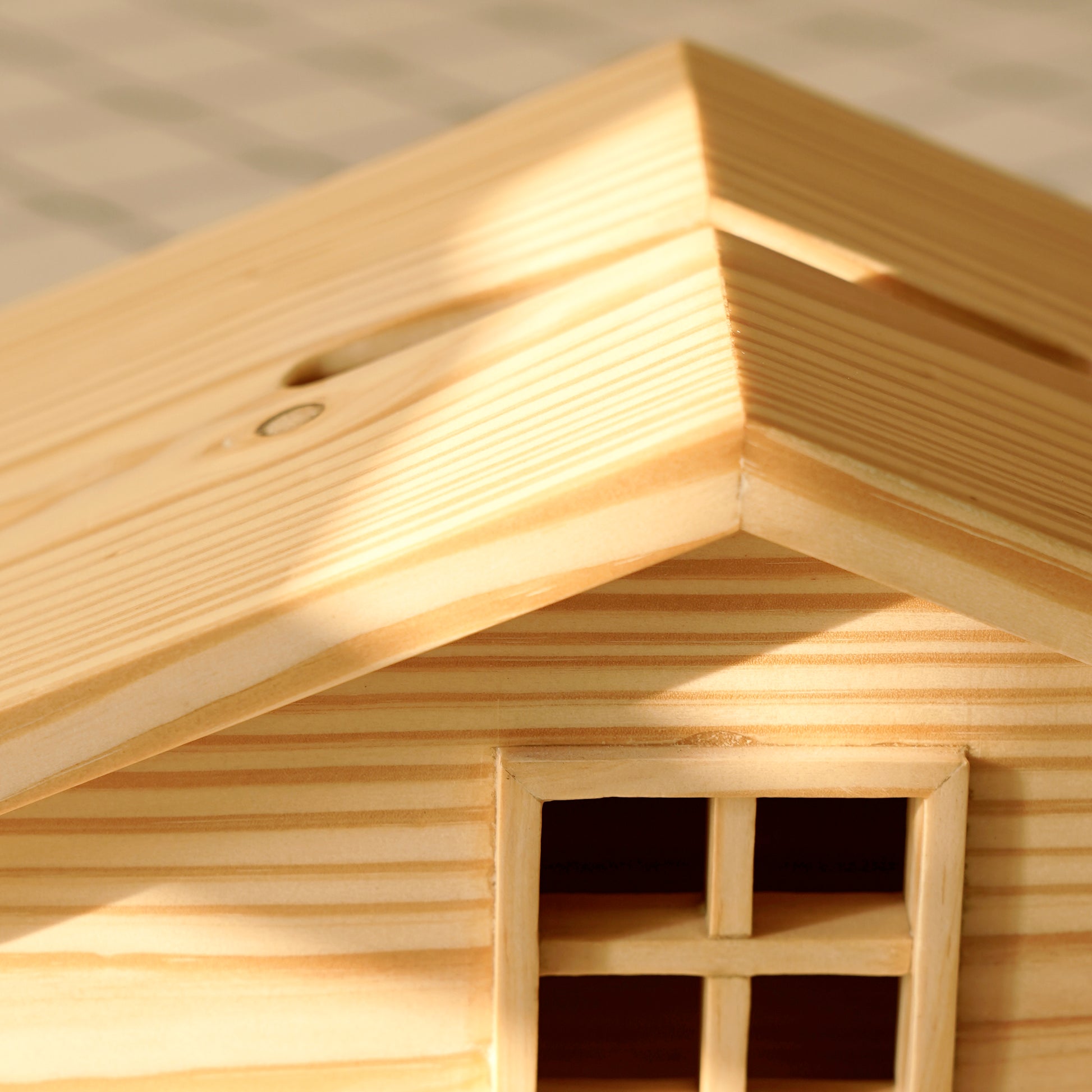 A Good Life wooden cabin style tissue holder featuring detailed roof and window design