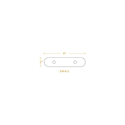 Small minimalist wall hanger measuring 9 inches by 2 inches with two mounting holes