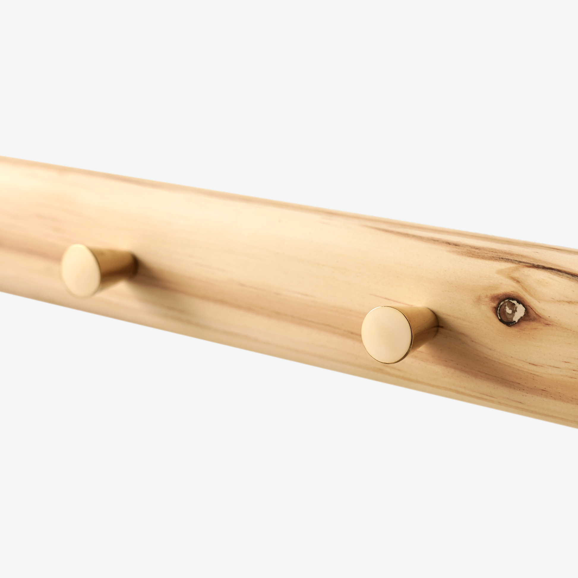 A Good Life minimalist wall hanger made of natural wood with two round pegs for hanging items