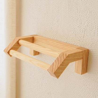 Handcrafted Scandinavian bathroom towel rail in solid pine wood featuring natural grain texture and minimalist aesthetic