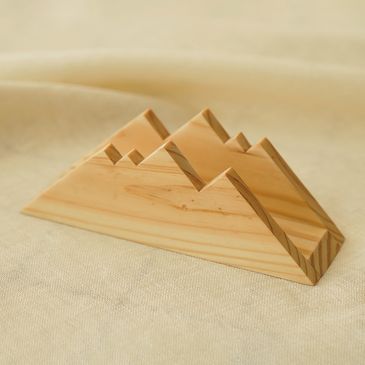 Scandinavian handcrafted napkin holder rack in natural pine wood for modern farmhouse kitchen table decor