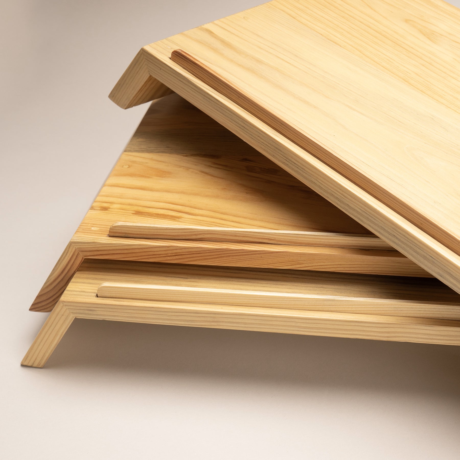 A Good Life minimalist laptop riser for desk made of natural wood with angled support