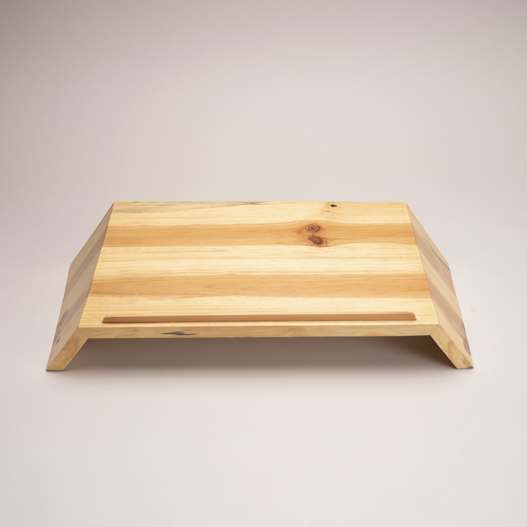 A Good Life minimalist laptop riser for desk made of natural wood with angled design